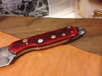 hand-forged red bone carry knife by Metals Artisan