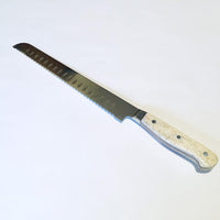 VG-10 serrated steel challah knife with custom handle